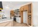 Modern kitchen featuring custom cabinetry, stainless steel appliances, and a wine rack at 2917 Golf Links Dr, Las Vegas, NV 89134