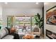 Cozy living room with patio access, modern furnishings, and backyard view at 2917 Golf Links Dr, Las Vegas, NV 89134