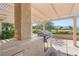 View of a built-in outdoor kitchen featuring a grill, counter space and pergola, ideal for entertaining at 2917 Golf Links Dr, Las Vegas, NV 89134