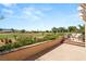 An outdoor seating area boasts a fire pit and chairs, with views of the golf course and mountains at 2917 Golf Links Dr, Las Vegas, NV 89134