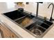 A sleek, modern sink featuring dual basin and unique faucet design at 2917 Golf Links Dr, Las Vegas, NV 89134