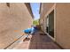 Cozy back patio with a barbecue grill and seating, perfect for outdoor entertaining at 3045 Camino Rico Ave, Henderson, NV 89044