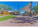 Inviting community area with manicured lawns, shade structures, and well-maintained landscaping at 3045 Camino Rico Ave, Henderson, NV 89044
