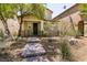 Charming home with a stone pathway leading to a covered porch and well-maintained landscaping at 3045 Camino Rico Ave, Henderson, NV 89044
