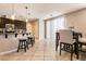 Open kitchen with barstool seating at the kitchen island and a dedicated dining space at 3045 Camino Rico Ave, Henderson, NV 89044
