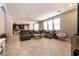 Open concept living area with tile floors, recessed lighting, and an adjoining modern kitchen at 3045 Camino Rico Ave, Henderson, NV 89044