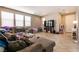 Comfortable living room featuring tile flooring and large windows with modern blinds at 3045 Camino Rico Ave, Henderson, NV 89044