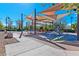 Fun-filled playground with swings, slides, and climbing structures, shaded by canopies at 3045 Camino Rico Ave, Henderson, NV 89044