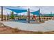 Community playground with climbing structures, a slide, and shaded areas for children to enjoy at 3045 Camino Rico Ave, Henderson, NV 89044