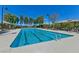 Resort-style pool with inviting blue water and shaded seating areas for residents to enjoy at 3045 Camino Rico Ave, Henderson, NV 89044