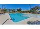 Sparkling pool with lounge chairs and umbrellas, ideal for relaxation and recreation at 3045 Camino Rico Ave, Henderson, NV 89044