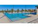 Community pool with ample lounge seating and clear, inviting water for relaxation and fun at 3045 Camino Rico Ave, Henderson, NV 89044