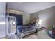 Bedroom featuring a queen sized bed, dark curtains, and an ornate mirror at 320 Ellen Marie Dr, Las Vegas, NV 89110