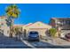 Charming single-story home with desert landscaping, mature palm tree, and attached two-car garage at 320 Ellen Marie Dr, Las Vegas, NV 89110
