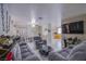 Open floor plan featuring the living room, dining area, and kitchen with tile flooring throughout at 320 Ellen Marie Dr, Las Vegas, NV 89110