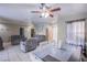 Inviting living room with dining area, tile flooring, and access to the front entry at 320 Ellen Marie Dr, Las Vegas, NV 89110