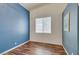 Cozy bedroom with blue accent wall and wood floors at 3336 Hidden Ridge St, Las Vegas, NV 89129