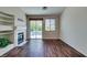 This living room has wood floors, fireplace, and a sliding door to the outside at 3336 Hidden Ridge St, Las Vegas, NV 89129