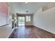 Bright living room boasts a fireplace, dark wood floors and sliding doors to the exterior at 3336 Hidden Ridge St, Las Vegas, NV 89129