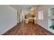 Bright open floor plan combining kitchen, dining and living areas with wood floors at 3336 Hidden Ridge St, Las Vegas, NV 89129