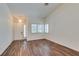Inviting living room with wood floors, vaulted ceilings, and bright natural light at 3336 Hidden Ridge St, Las Vegas, NV 89129