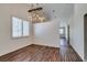 Inviting living room with wood floors, vaulted ceilings, and bright natural light at 3336 Hidden Ridge St, Las Vegas, NV 89129
