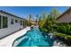 Enjoy a backyard swimming pool with spa, mature privacy landscaping and home exterior at 3336 Hidden Ridge St, Las Vegas, NV 89129