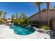 Backyard pool offers a spa and lush landscaping, perfect for entertaining at 3336 Hidden Ridge St, Las Vegas, NV 89129