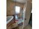 Bathroom features a sleek glass-enclosed shower, window, and a modern design at 3480 E Hacienda Ave, Las Vegas, NV 89120