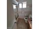 View of a tiled bathroom with a shower-tub combo, toilet, vanity and granite countertop at 3480 E Hacienda Ave, Las Vegas, NV 89120
