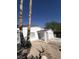 Front view of a white brick house featuring a gated entry and minimal landscaping at 3480 E Hacienda Ave, Las Vegas, NV 89120