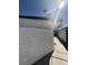 View of the exterior of the house, showcasing stucco walls and a narrow pathway at 3480 E Hacienda Ave, Las Vegas, NV 89120