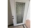 Close-up of a white front door with decorative glass panel at 3480 E Hacienda Ave, Las Vegas, NV 89120