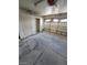 Garage interior featuring concrete floors, a closet, and overhead lighting at 3480 E Hacienda Ave, Las Vegas, NV 89120