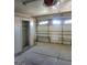 Image of empty garage with a concrete floor, built in closet and windowed garage door at 3480 E Hacienda Ave, Las Vegas, NV 89120