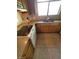 This kitchen has an electric cooktop on the range and wood cabinets around it at 3480 E Hacienda Ave, Las Vegas, NV 89120
