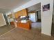 This shows an eat in kitchen featuring wood cabinetry and tile flooring at 3480 E Hacienda Ave, Las Vegas, NV 89120