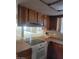 This is a close up on the cooking range with wood cabinets above the counter at 3480 E Hacienda Ave, Las Vegas, NV 89120