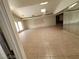 Spacious living area with tiled floor, mirrored wall and backyard pool views through large picture window at 3480 E Hacienda Ave, Las Vegas, NV 89120