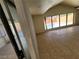 Living space featuring tile flooring and a large window with views of the backyard pool at 3480 E Hacienda Ave, Las Vegas, NV 89120