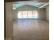 Bright and airy living room with large windows overlooking the backyard pool at 3480 E Hacienda Ave, Las Vegas, NV 89120