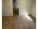 Neutral tiled living area connecting to other rooms, adaptable to any decor at 3480 E Hacienda Ave, Las Vegas, NV 89120