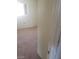 Bedroom with neutral carpet and a window for natural light, doorway view at 3601 Valley Forge Ave, Las Vegas, NV 89110