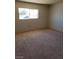 Empty bedroom with carpet, window providing natural light, awaiting personal touches at 3601 Valley Forge Ave, Las Vegas, NV 89110