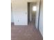 Bedroom with neutral carpeting, with views to other rooms through open doors at 3601 Valley Forge Ave, Las Vegas, NV 89110
