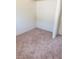 Empty walk-in closet space featuring neutral carpeting and white walls at 3601 Valley Forge Ave, Las Vegas, NV 89110