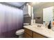 Bathroom features a neutral color scheme, single sink vanity, and white medicine cabinet at 3609 Indigo Flower St # 1, North Las Vegas, NV 89084