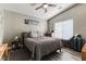 Cozy bedroom features a neutral color palette, ceiling fan, and wood-look flooring at 3609 Indigo Flower St # 1, North Las Vegas, NV 89084