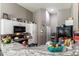 Kitchen area featuring granite countertops, modern appliances, and ample cabinet space at 3609 Indigo Flower St # 1, North Las Vegas, NV 89084