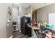 Updated kitchen featuring granite countertops, black appliances, and a view to the hallway at 3609 Indigo Flower St # 1, North Las Vegas, NV 89084